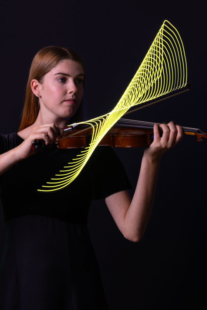 Violin player with light streaks