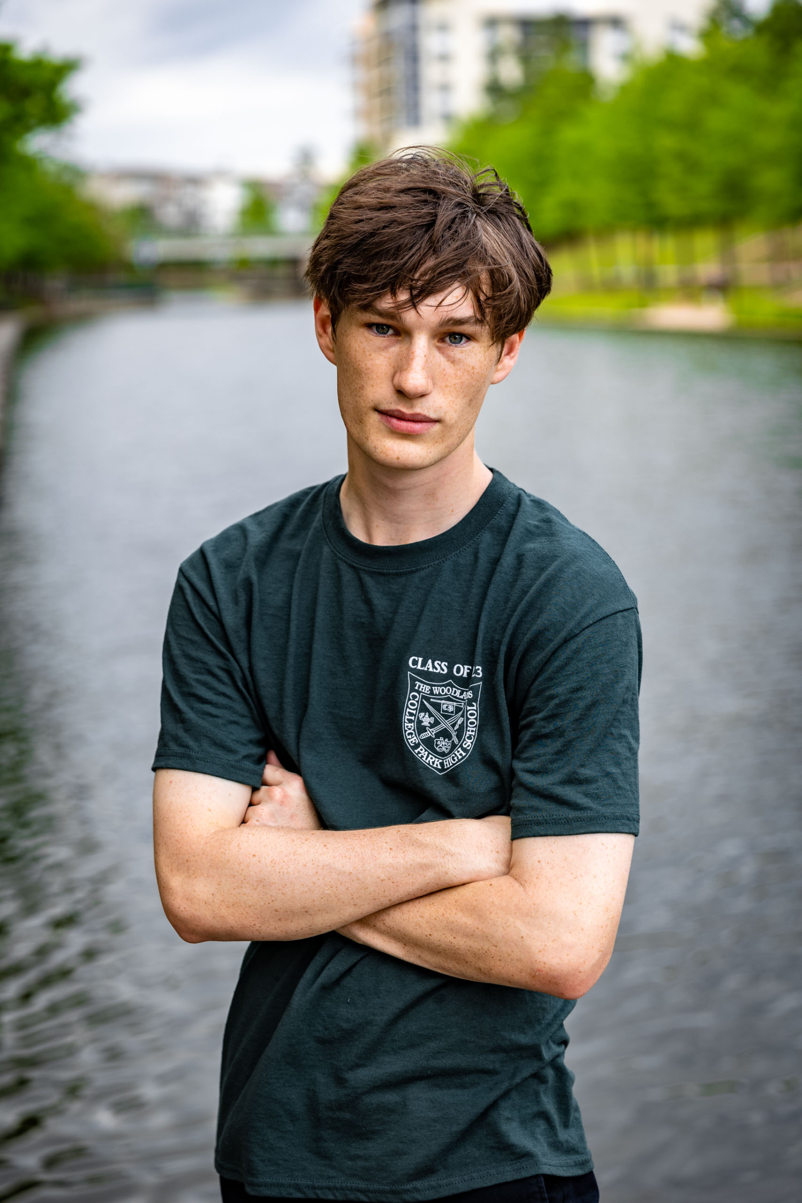 College Park High School senior standing near Woodlands Waterway.